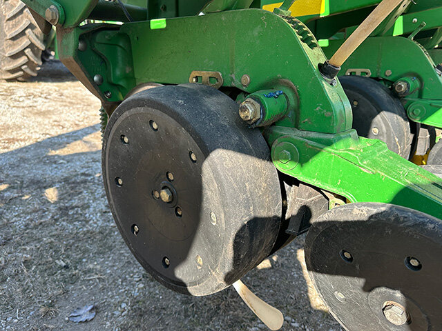 side view 1 of a gauge wheel and closing wheel on the 2008 John Deere 17 60 12 row 30 inch planter